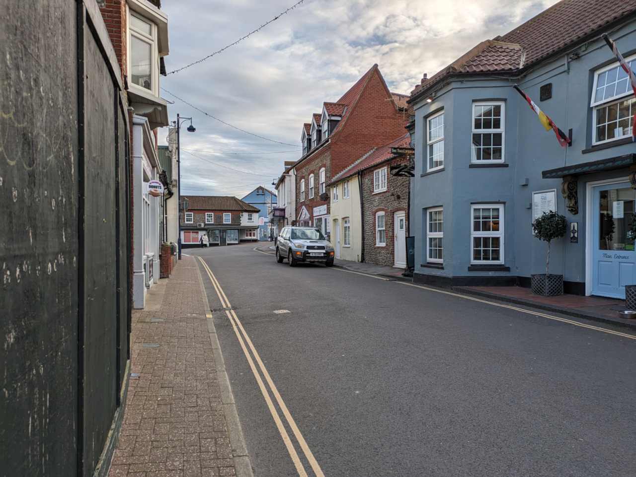 Street in Sheringham with car parked on side of road