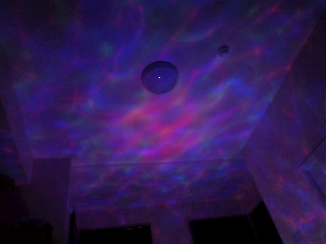multi-coloured wave pattern. projected onto a ceiling.