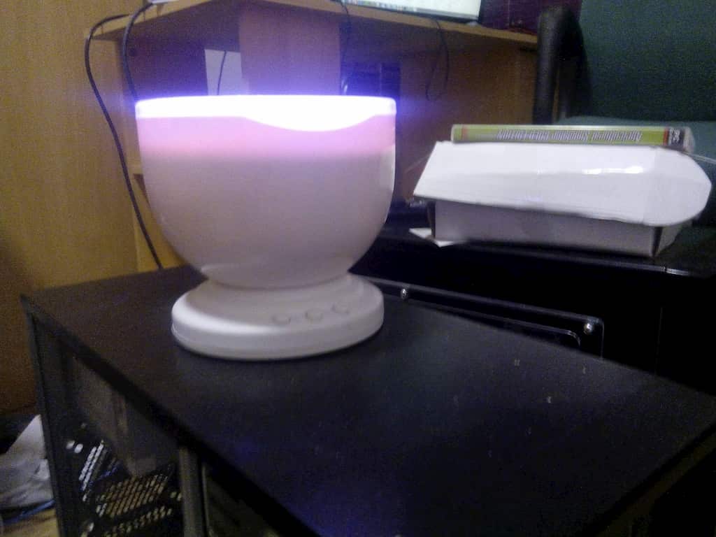 Aurora master Wave. bowl shaped device on top computer case.