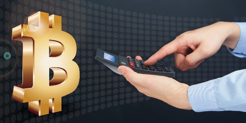 Man using calculator next to the bitcoin currency symbol